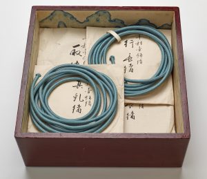 Tray for the inner storage box of the tea-leaf storage jar named Chigusa, with ornamental cords and storage envelopes. Photo Credit: Courtesy Freer Gallery of Art.