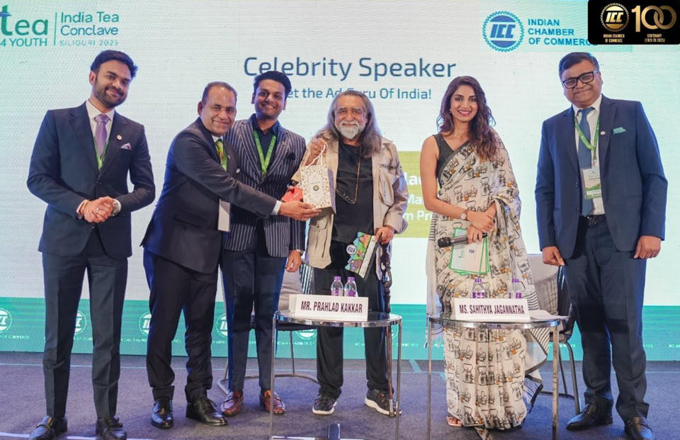 Officials with with keynote speaker Prahlad Kakkar, center